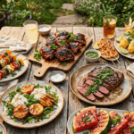 An overhead spread of grilled summer cookout dishes including BBQ chicken, steak, shrimp skewers, corn, and grilled peach salad